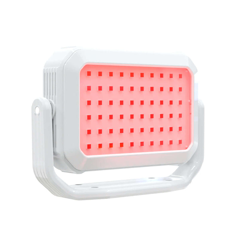 Handheld red light therapy device with a sleek design, featuring a bright pink light for effective skincare treatments.